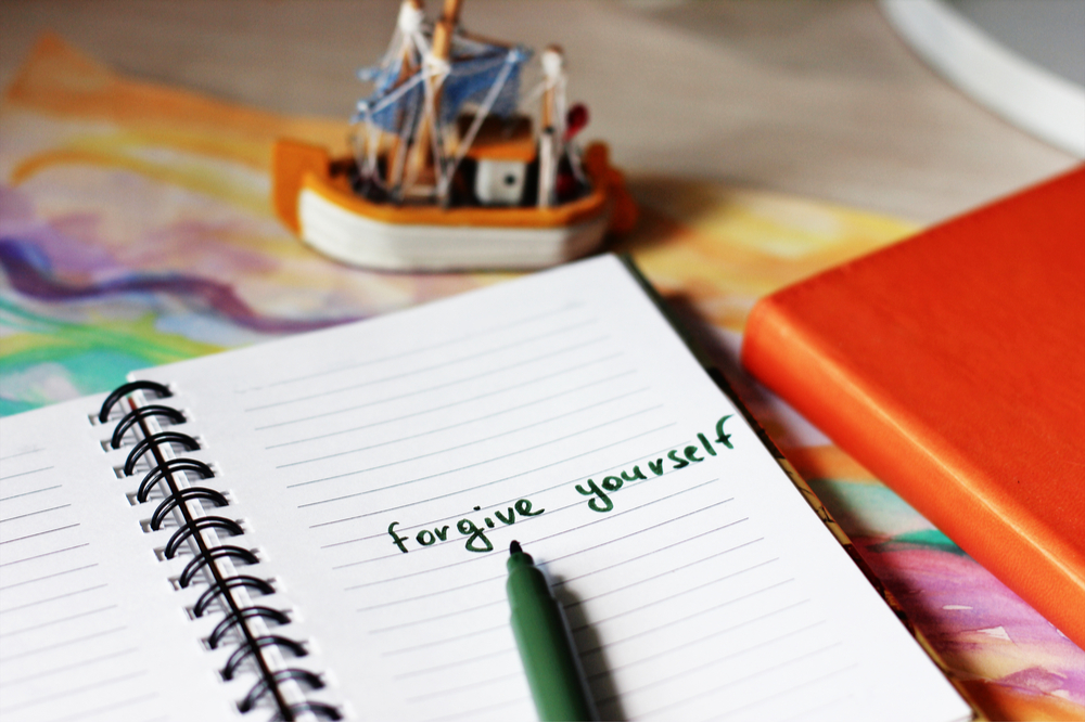 A journal message stating forgive yourself and practicing self-forgiveness after relapse