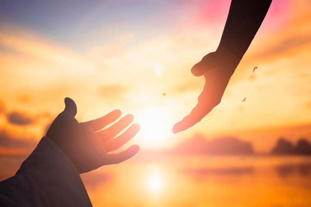 a sunset a person reaches out and admits that they need help with addiction