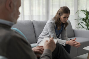 Person talking with their therapist at an individual therapy program
