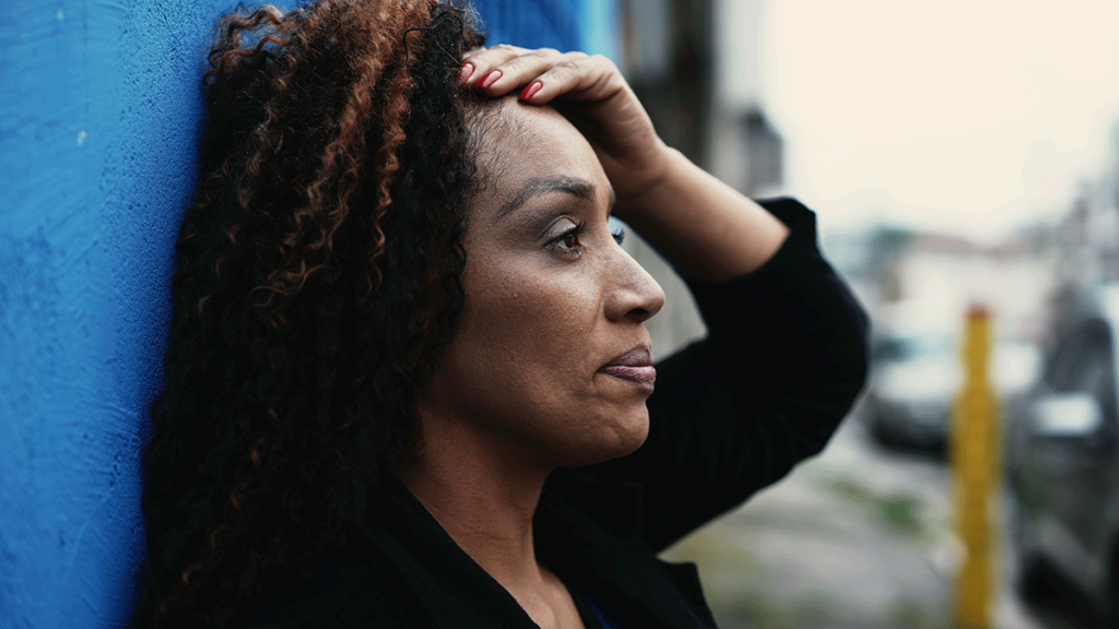 Person resting against wall and wondering how addictive heroin is