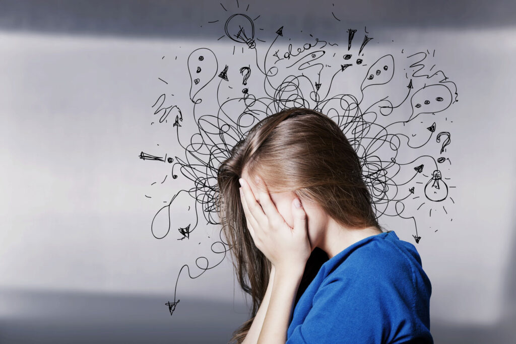Person with face in hands, finding out about the types of anxiety