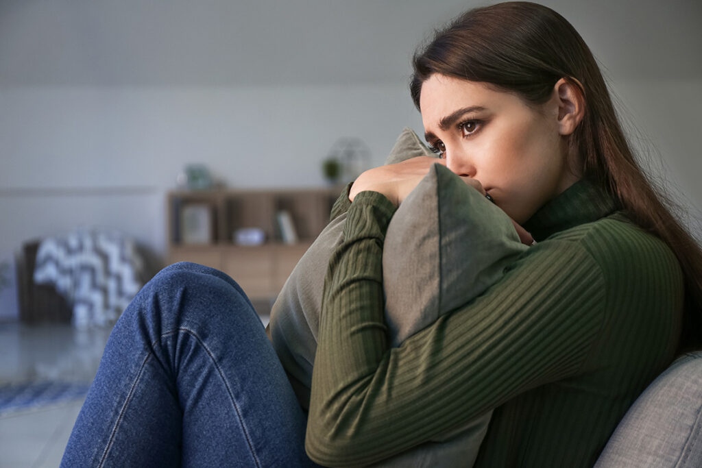 Person thinking about the link between alcohol and mental health